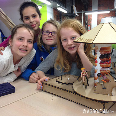 Students present  proudly their model